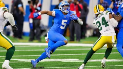 David Montgomery running with football