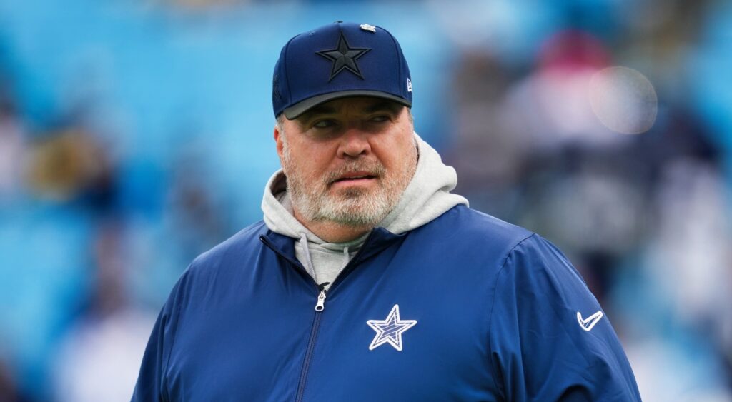 Mike McCarthy of Dallas Cowboys looking on.