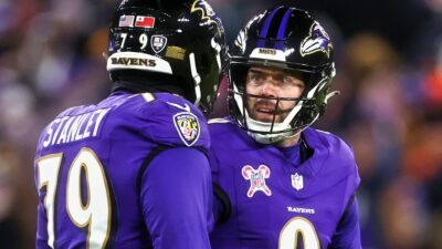 Justin Tucker with Ronnie Stanley