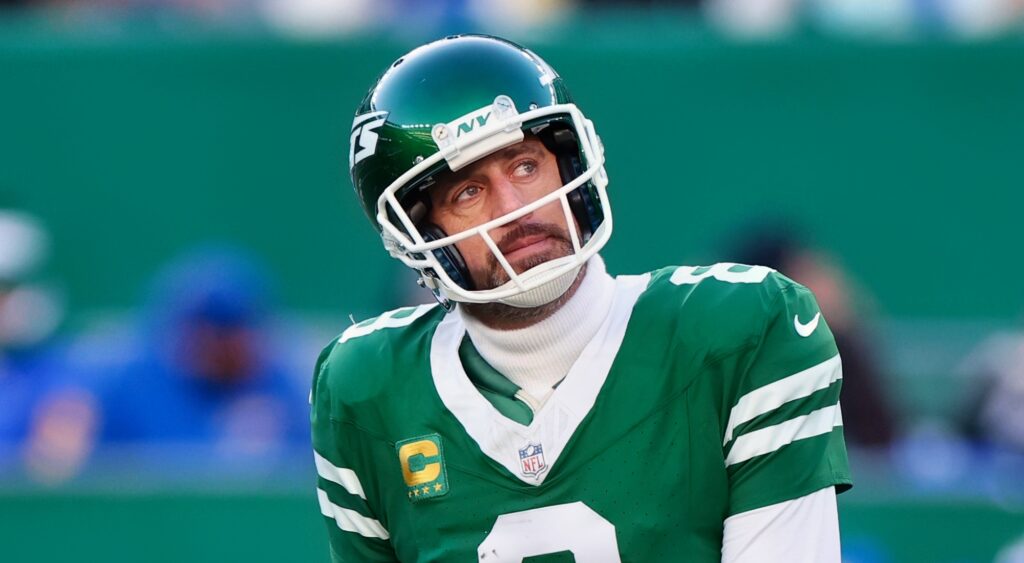 Aaron Rodgers of New York Jets looking on.