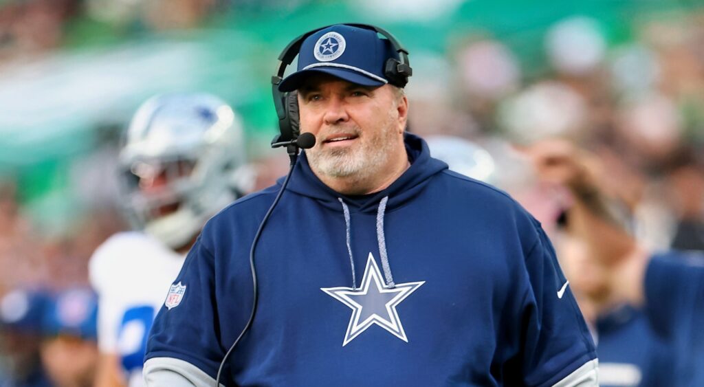 Mike McCarthy of Dallas Cowboys looking on.