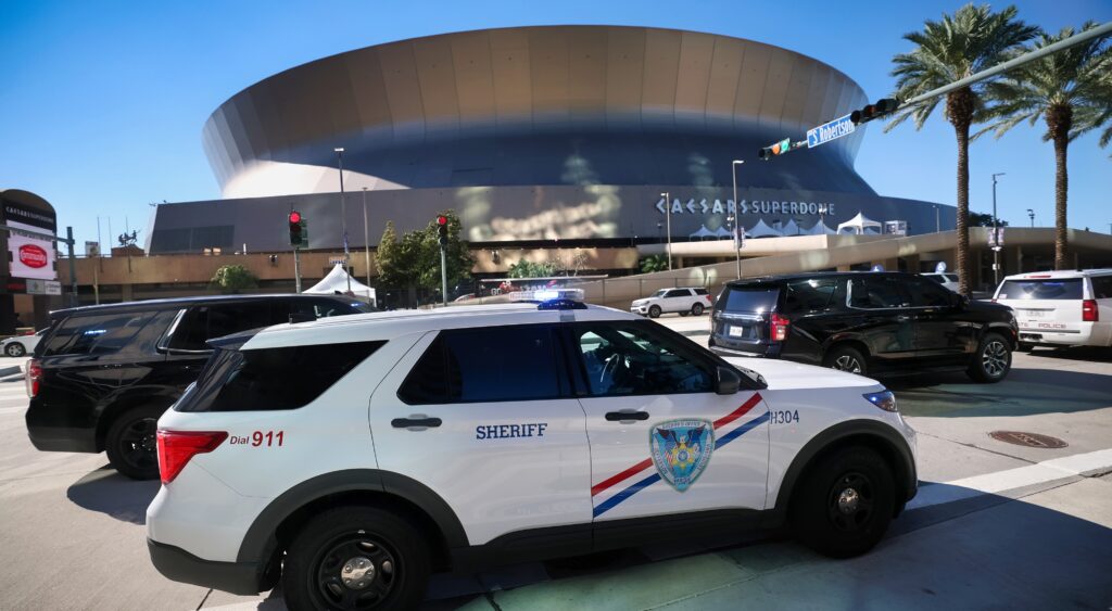 Cop car in front of Caesars Superdome
