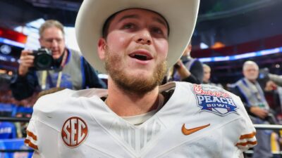 Quinn Ewers in Texas uniform and cowboy hat