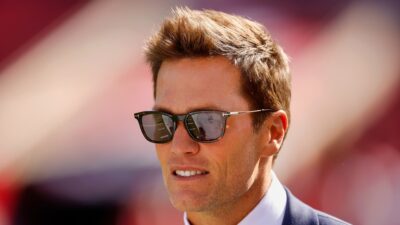 Tom Brady in sunglasses and a suit