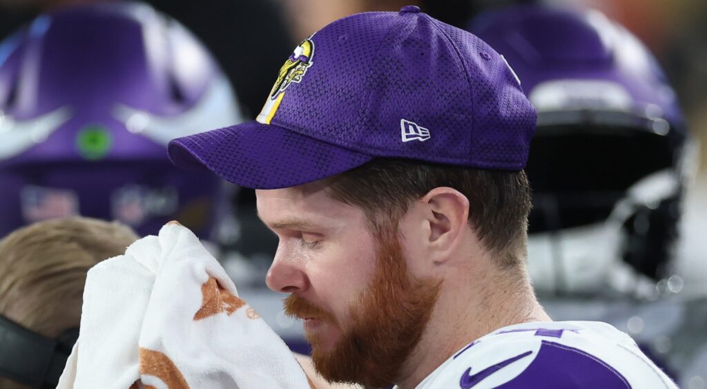 Sam Darnold reacts on sidelines.