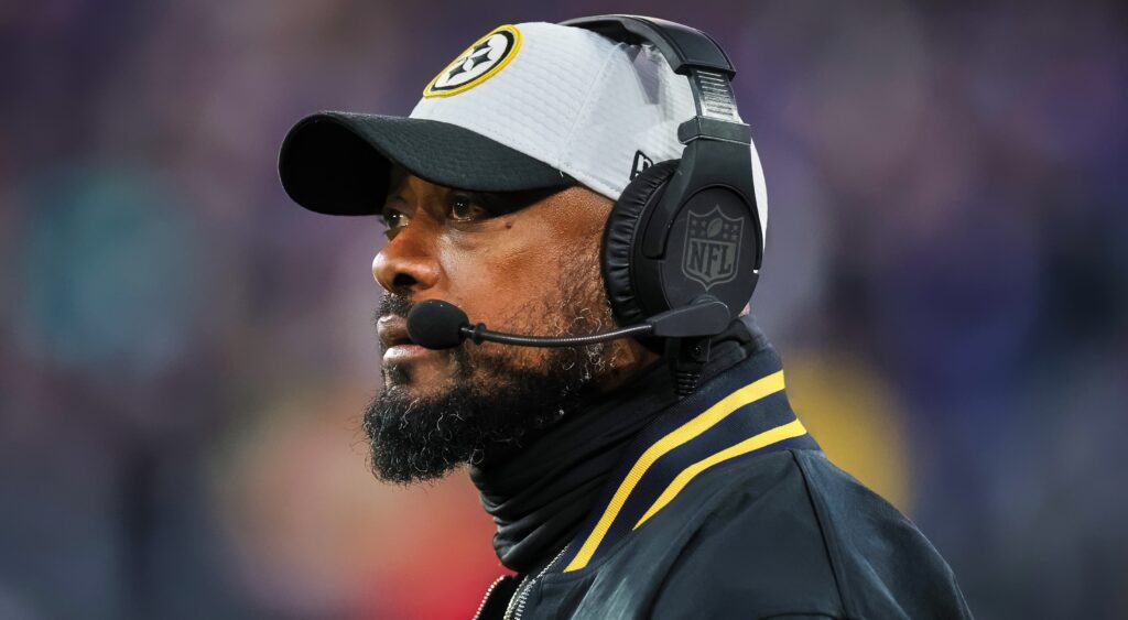 Mike Tomlin looks on.