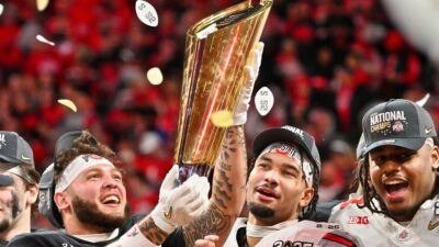 Ohio State players holding National Title