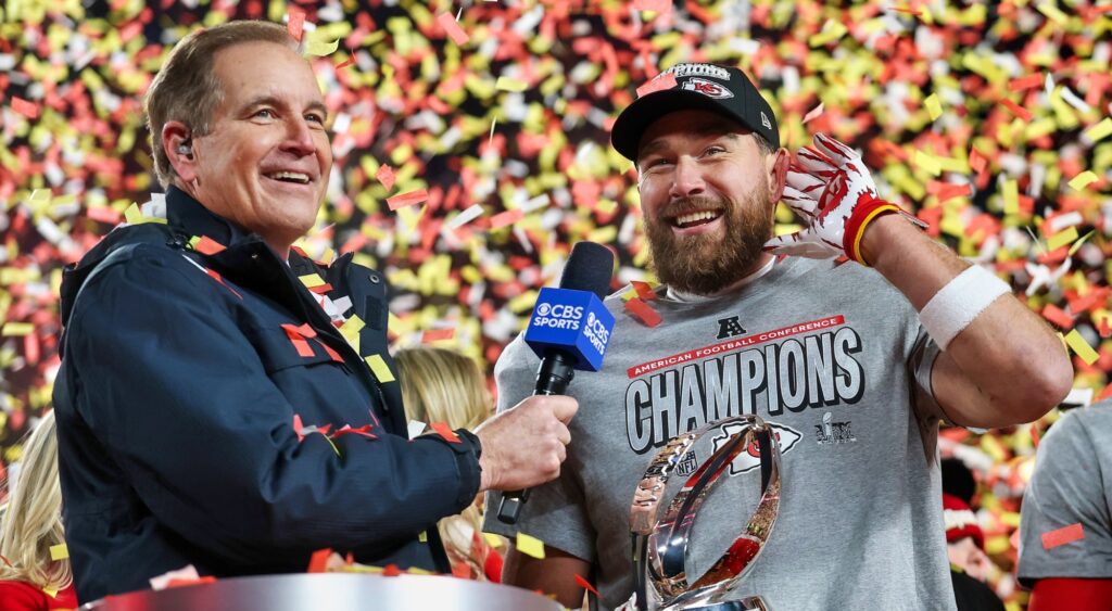 Jim Nantz and Travis Kelce talking after game.