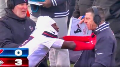 Houston Texans cb and coach on sidelines