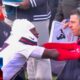 Houston Texans cb and coach on sidelines