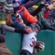 Jonathan Owens attempting Lambeau Leap