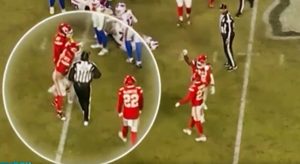 Kansas City Chiefs players and ref on field