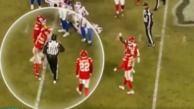 Kansas City Chiefs players and ref on field