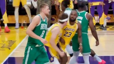 LeBron James was caught on camera with an intense stare at Kristaps Porzingis after delivering a vicious poster dunk on him