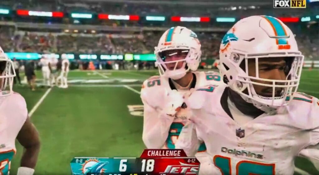 Miami Dolphins players on field