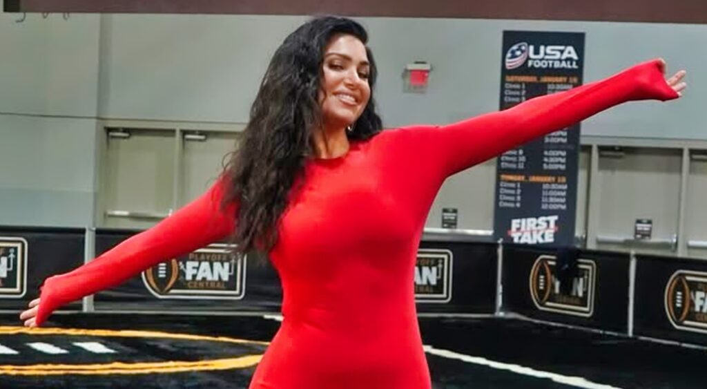 Molly Qerim posing in red outfit