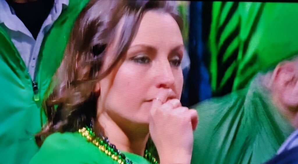 Notre Dame fan with a hand over her mouth