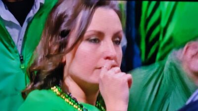 Notre Dame fan with a hand over her mouth