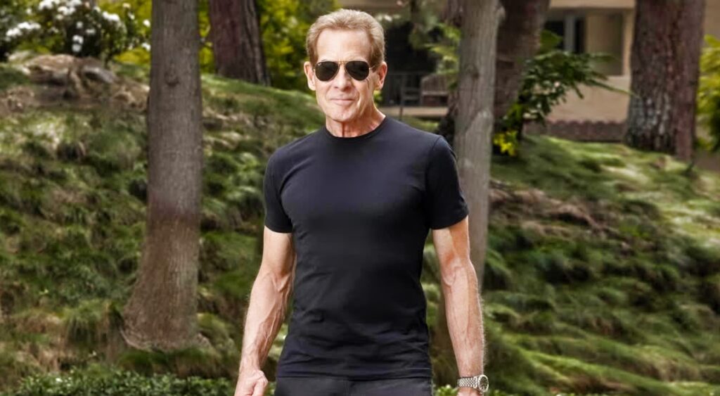 Skip Bayless in black T-shirt and sunglasses