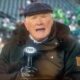 Terry Bradshaw holding mic