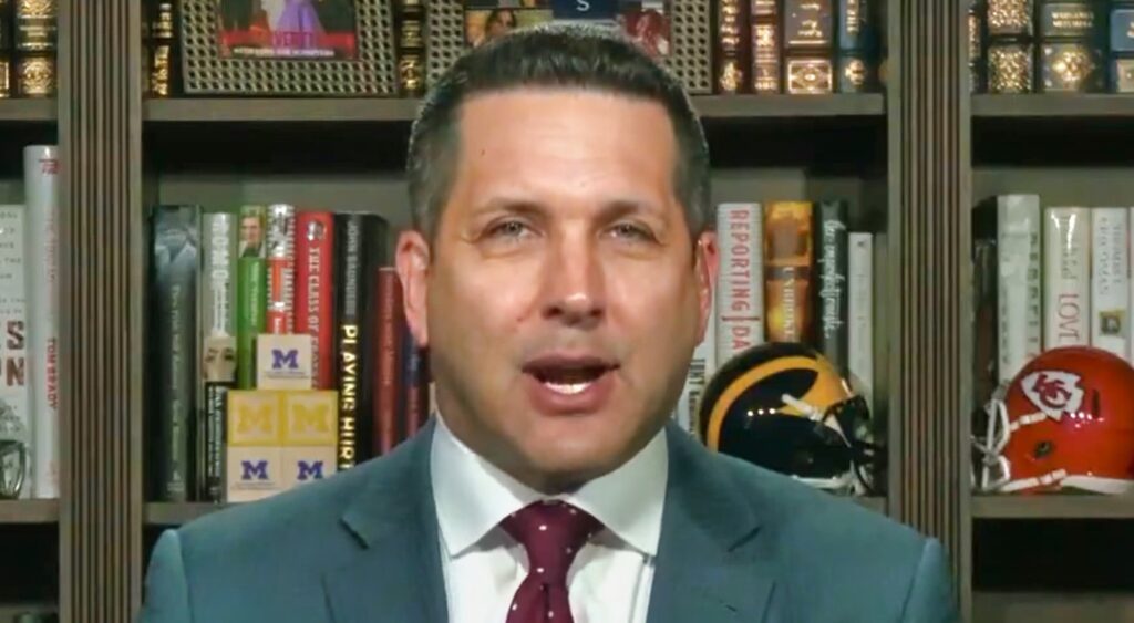 Adam Schefter looking on.