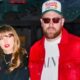 Taylor Swift standing next to Travis Kelce