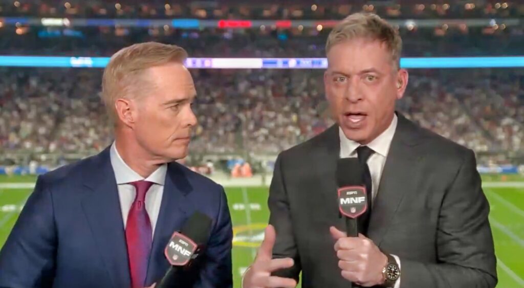 Joe Buck and Troy Aikman speaking in broadcast booth.