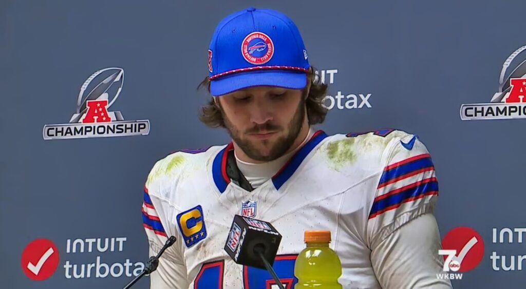 Buffalo Bills quarterback Josh Allen looking on.