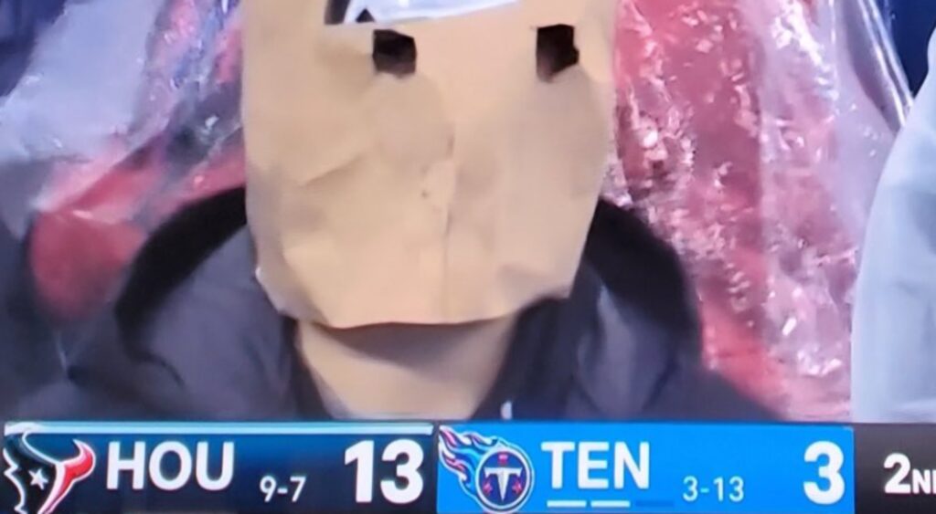 Tennessee Titans fan wearing a Shedeur Sanders paper bag.