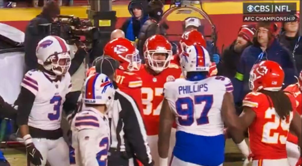 Travis Kelce and Jordan Phillips arguing during game.