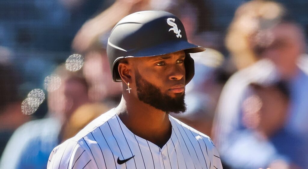 Luis Robert Jr. looking on.