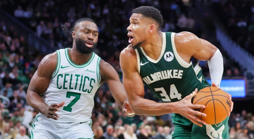 Jaylen Brown and Giannis Antetokounmpo react during game.