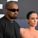 Kanye West (L) and Australian model Bianca Censori posing at Grammys