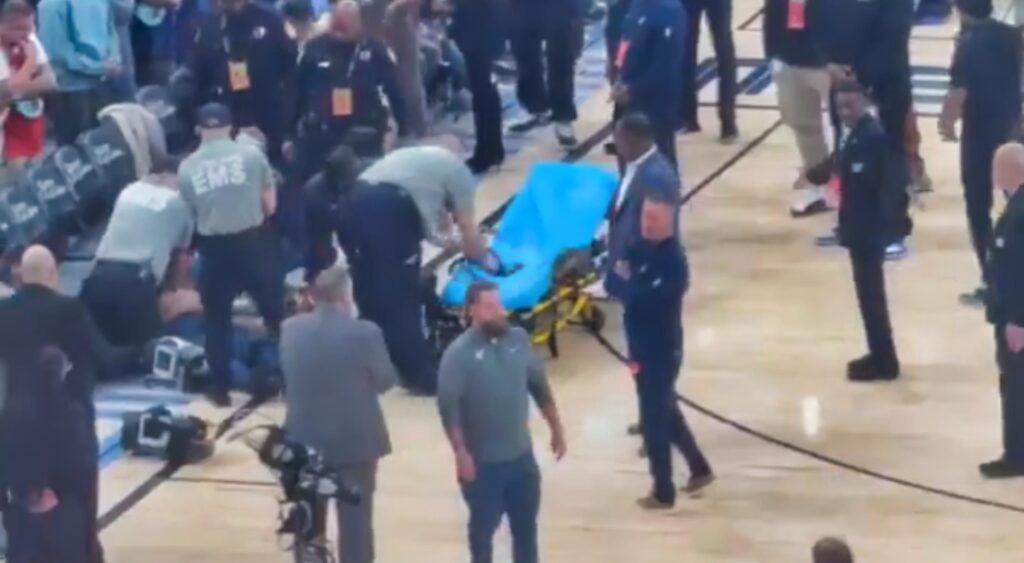 Grizzlies And Spurs Game game with fan on court with stretcher