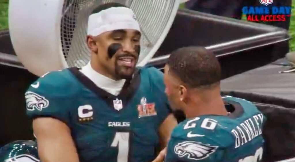 Jalen Hurts and Saquon Barkley on the sideline.