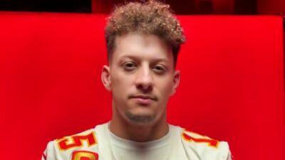 Patrick Mahomes in front of red background