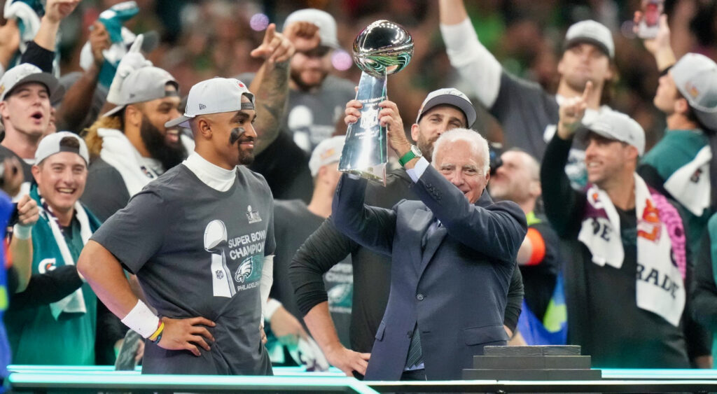 Philadelphia Eagles' Owner and Jalen Hurts holding Super Bowl trophy