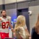 Travis Kelce walking to locker room