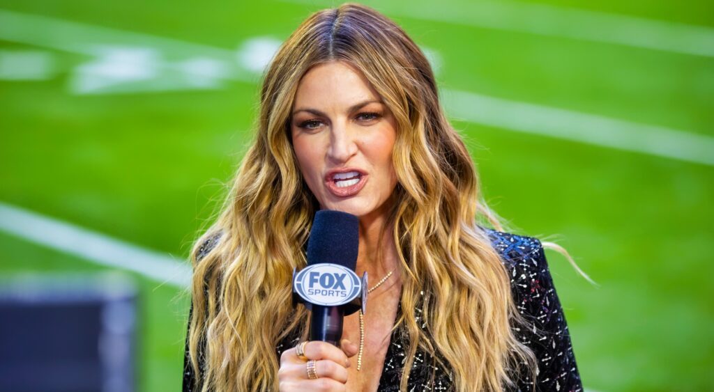 Erin Andrews during broadcast with microphone in hand