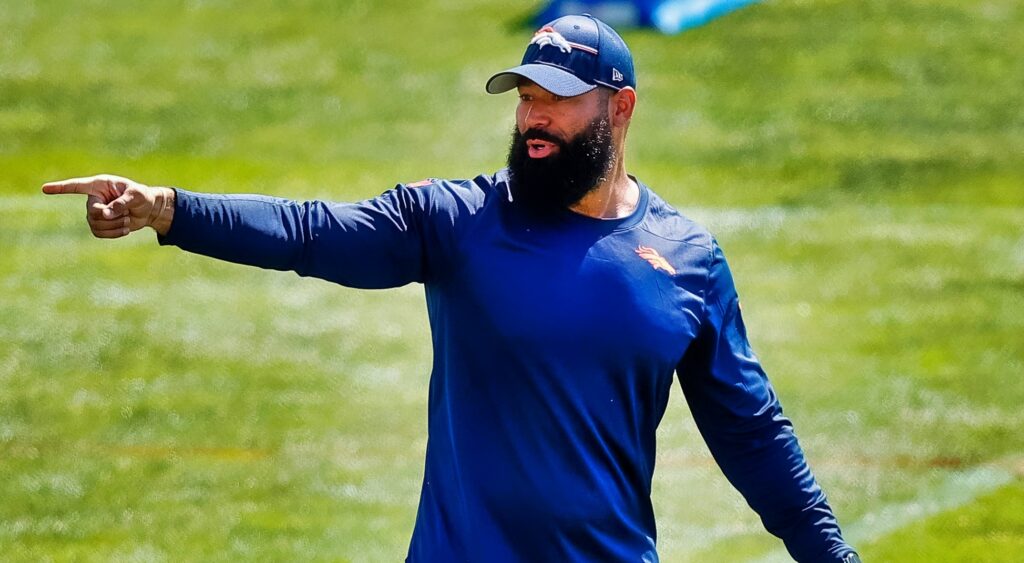 Denver Broncos outside linebackers coach Michael Wilhoite on the field