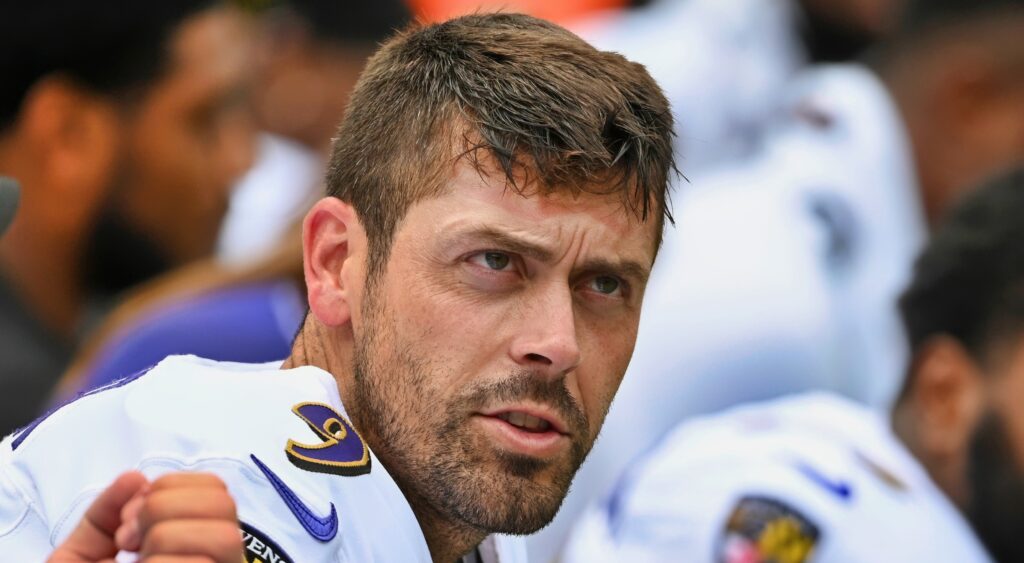 Justin Tucker seated on the bench