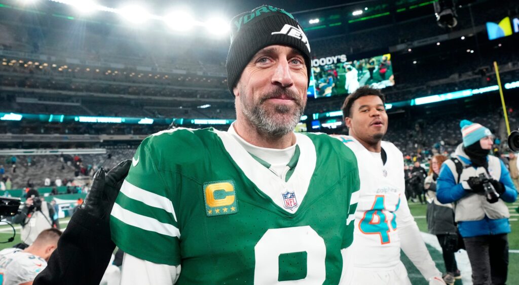 Aaron Rodgers smiling while in uniform