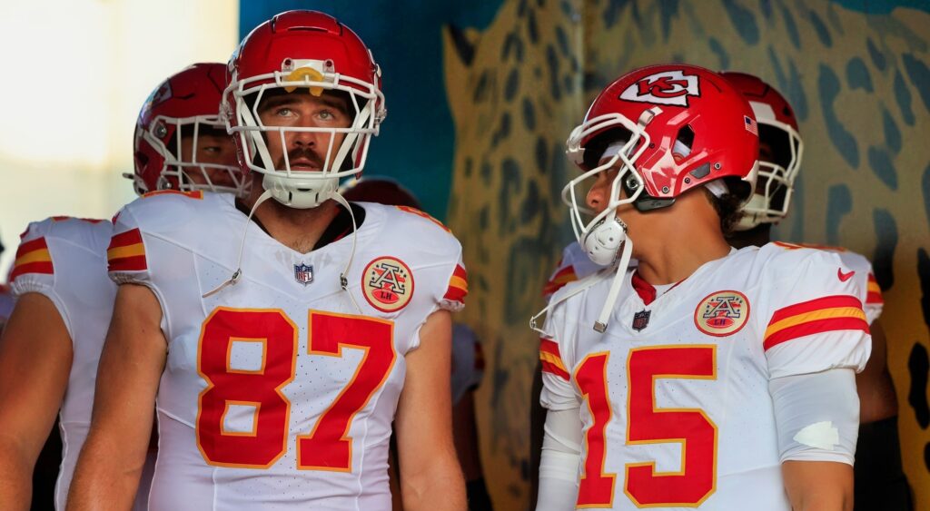 Travis Kelce and Patrick Mahomes look on at game.