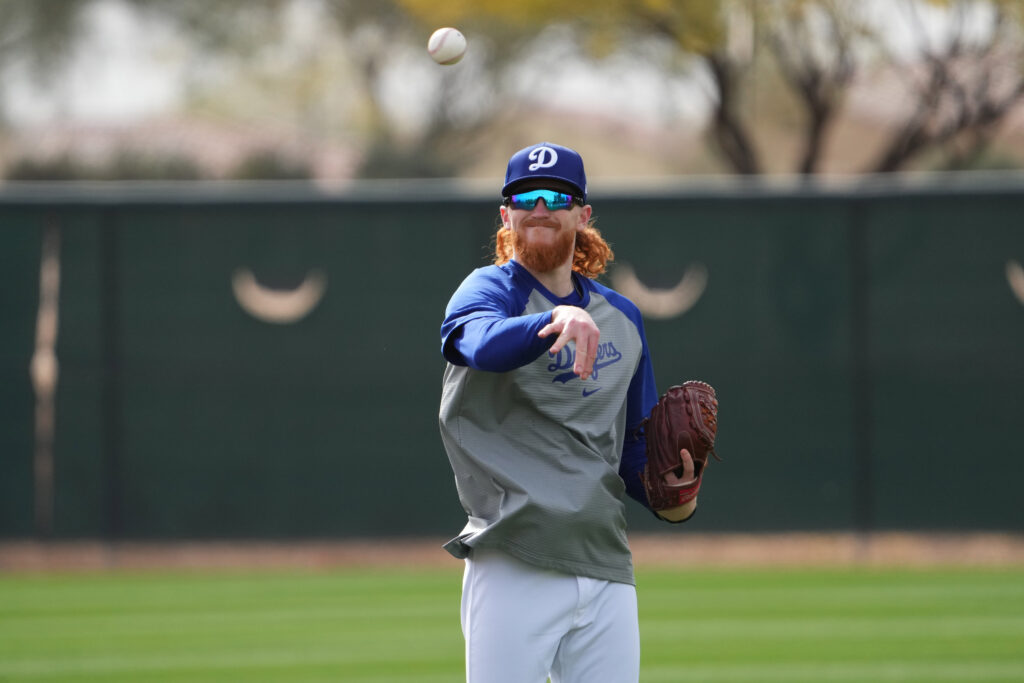 Dustin May throwing a pitch.