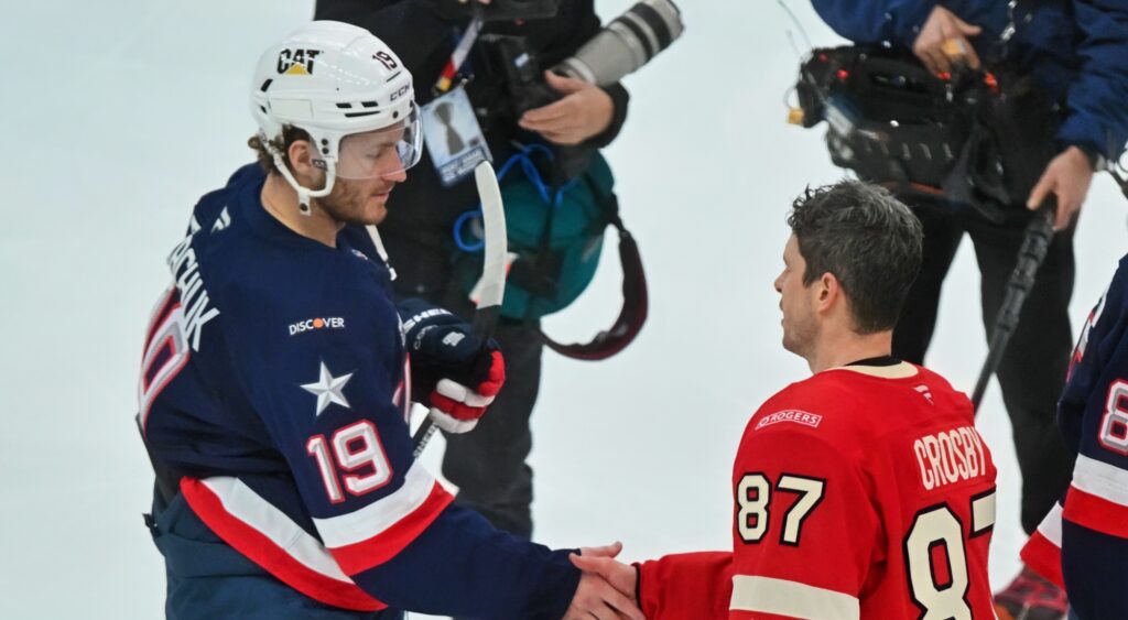 Matthew Tkachuk and Sidney Crosby shaking hands.