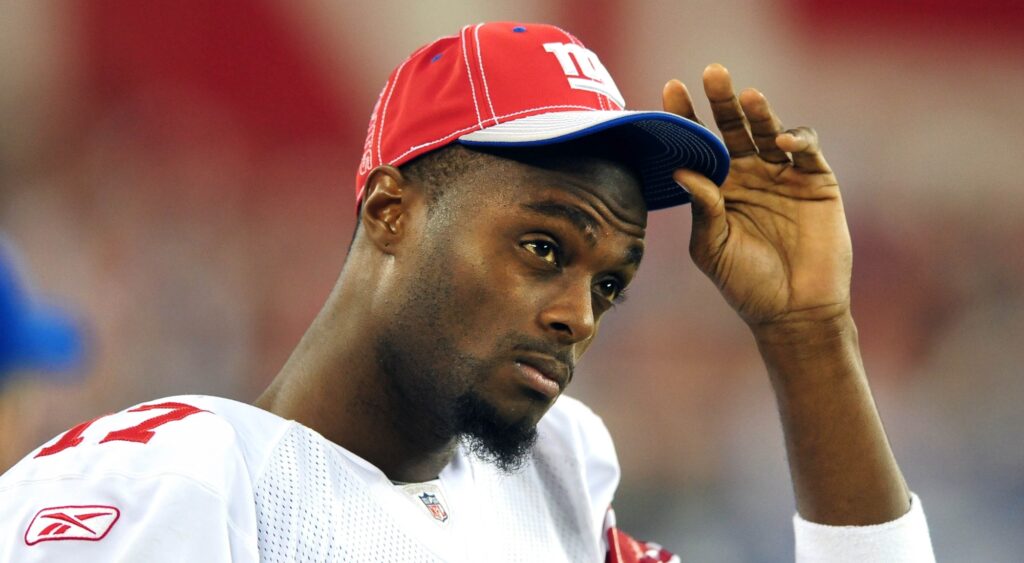 Plaxico Burress reacts at game.