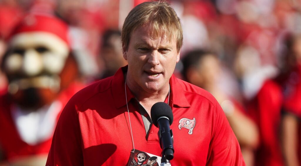 Jon Gruden speaking into mic