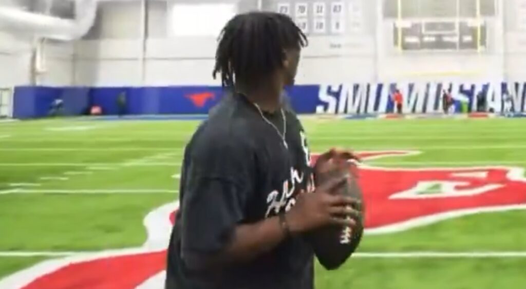 Cam Ward preparing to throw a football in practice.