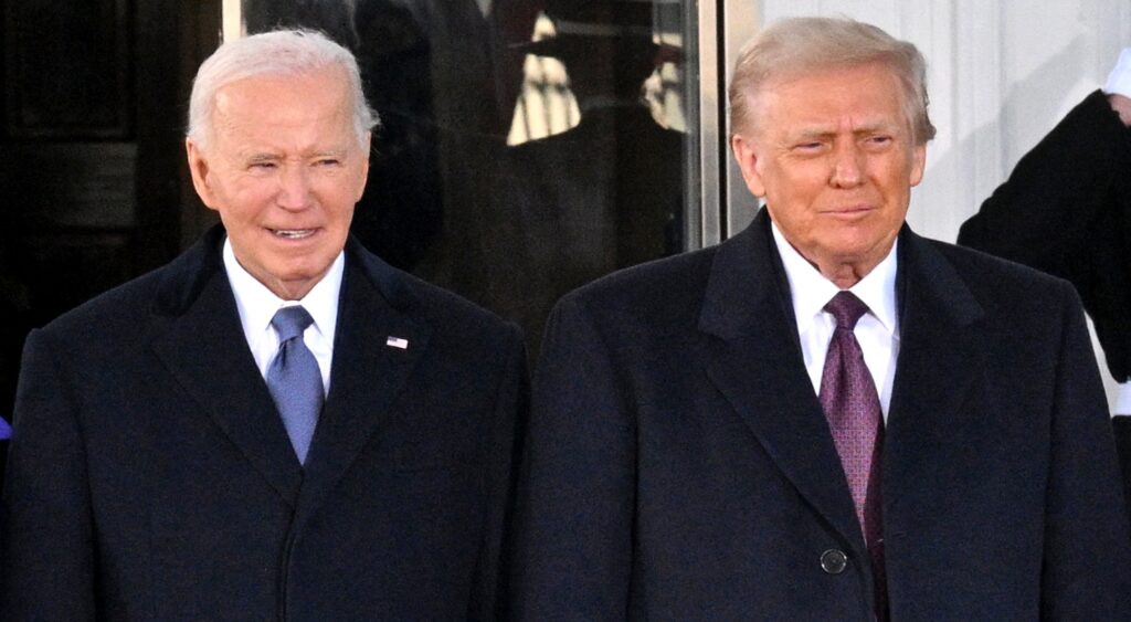 Joe Biden and Donald Trump look on at event.