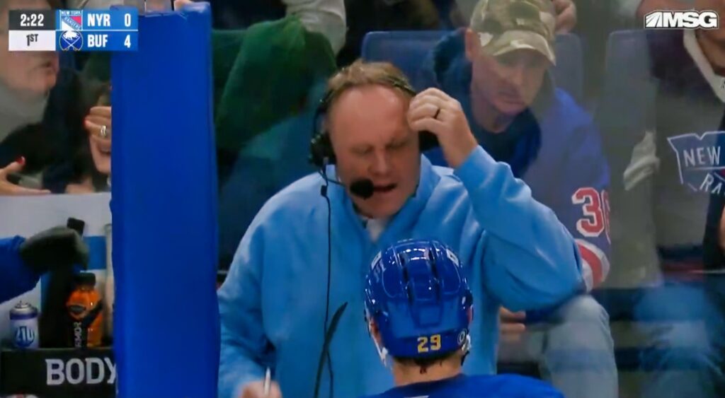 Rob Ray reacts after taking puck to the head.